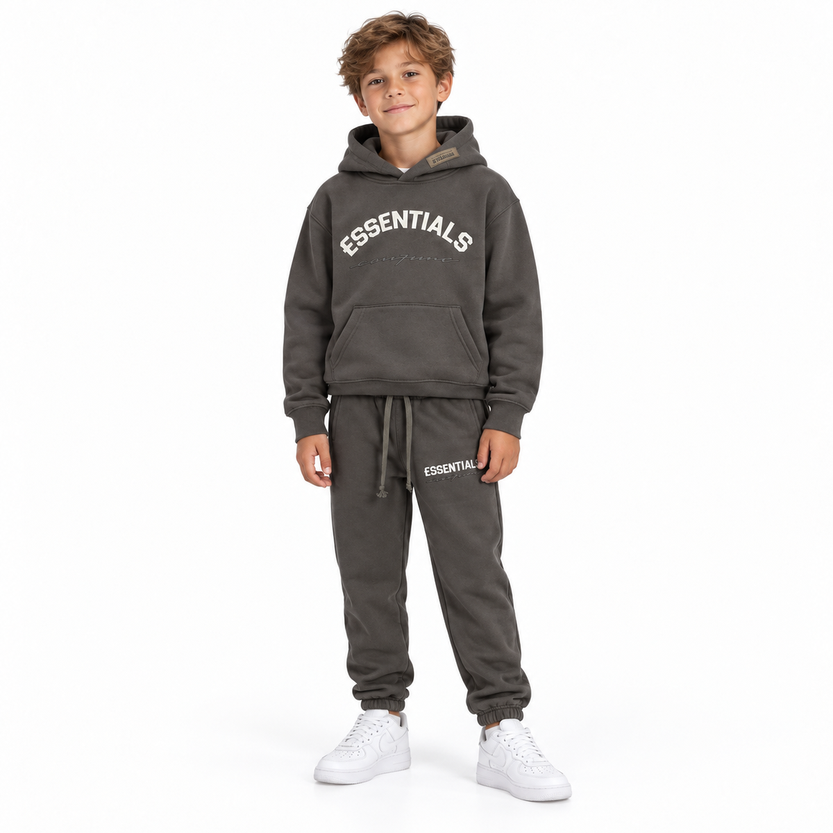 Essentials Cou7ure kids Curve Tracksuit donkergrijs gedragen in maat 10 jaar – designer kinderkleding | Niñoz Almere
